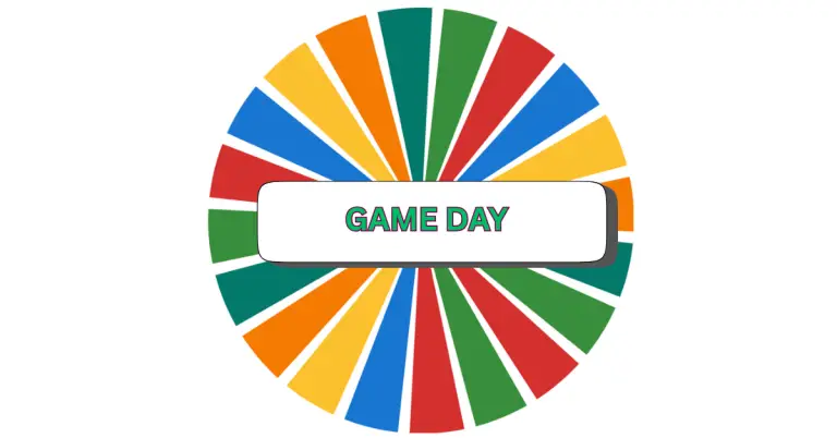 A colorful spinning wheel features alternating green, red, yellow, and blue segments, with a white rectangle at the center proudly displaying GAME DAY in bold green letters—setting an exciting tone for your next game day event.
